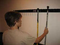 Rink Rack is the solution!  Easy to use, safely manage hockey sticks, lacrosse stick, baseball bats, and much more.
